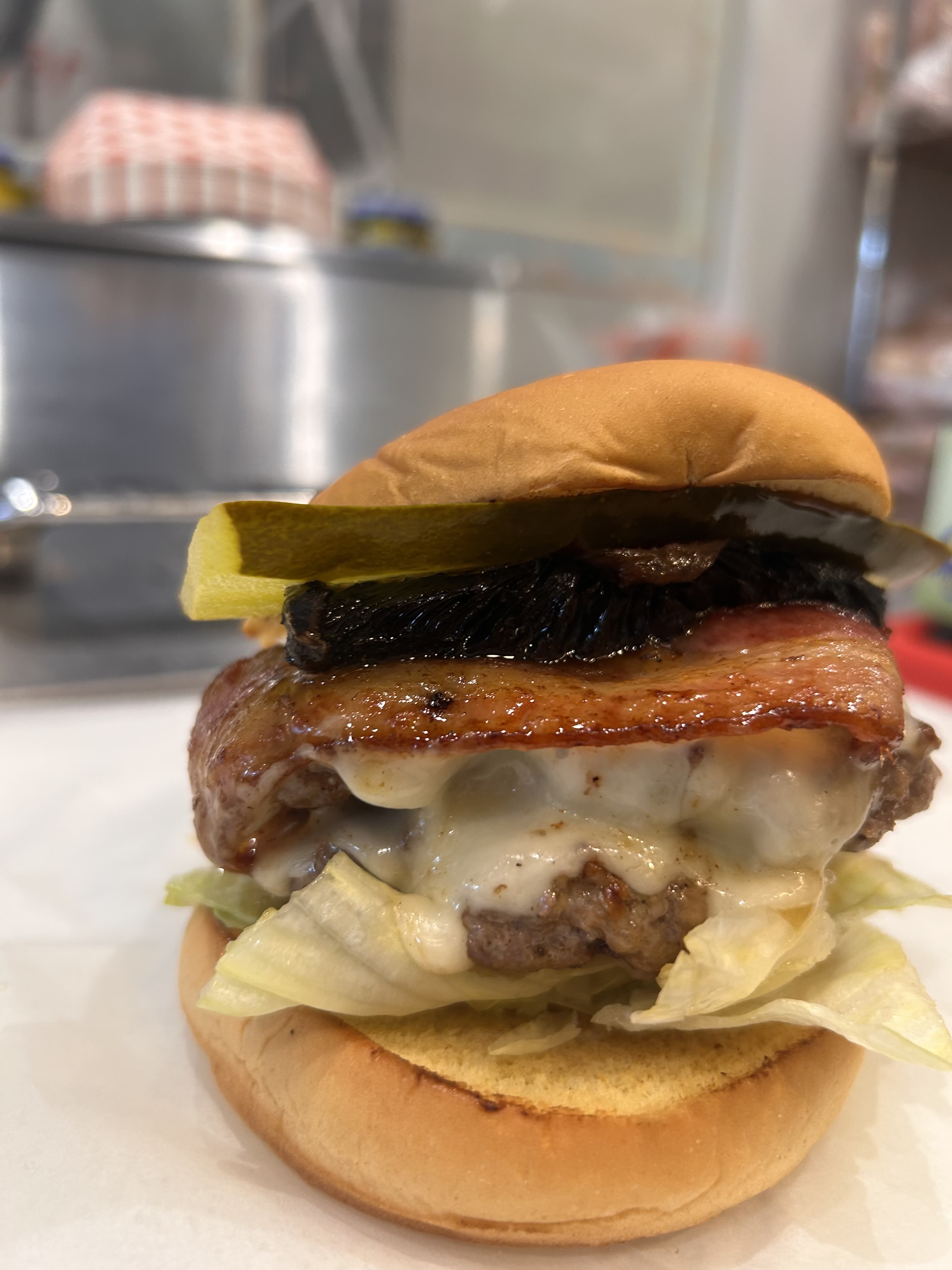 Bikini Burger with bacon, pickle and melted cheese
